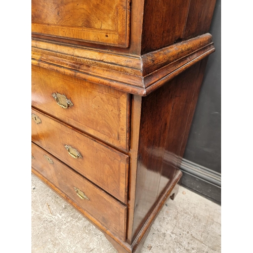 1043 - A George I/II walnut and feather banded chest on chest, 97.5cm wide.