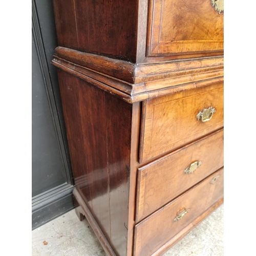 1043 - A George I/II walnut and feather banded chest on chest, 97.5cm wide.