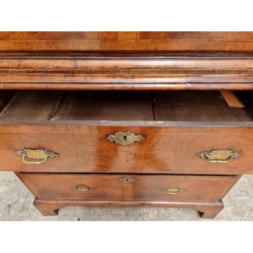 1043 - A George I/II walnut and feather banded chest on chest, 97.5cm wide.