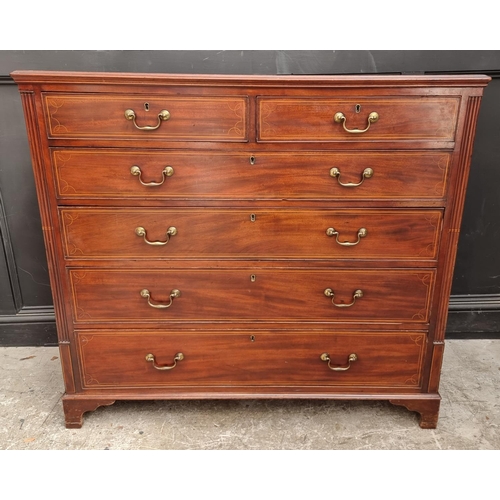 1044 - A George III mahogany and line inlaid chest of drawers, 133cm wide.