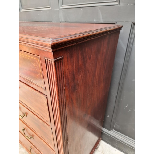 1044 - A George III mahogany and line inlaid chest of drawers, 133cm wide.