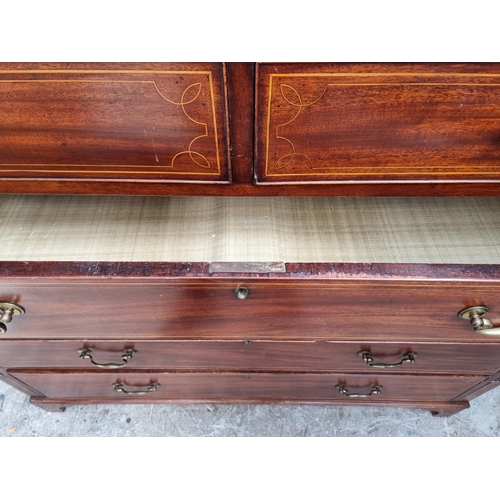 1044 - A George III mahogany and line inlaid chest of drawers, 133cm wide.