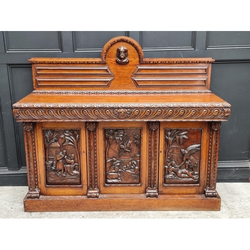 1046 - A large late 19th century Flemish carved oak sideboard, 164cm wide.