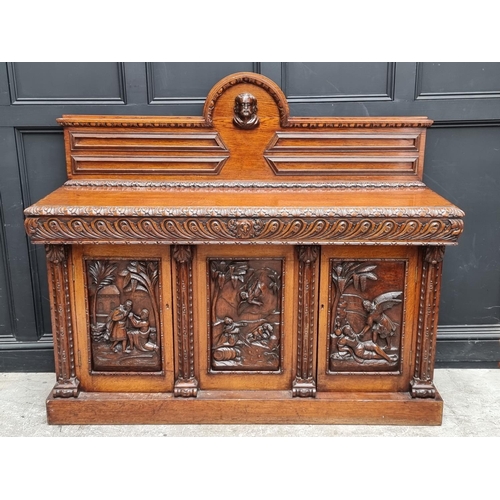 1046 - A large late 19th century Flemish carved oak sideboard, 164cm wide.