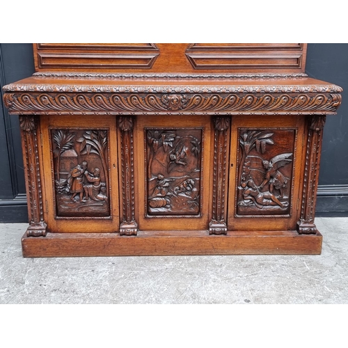 1046 - A large late 19th century Flemish carved oak sideboard, 164cm wide.