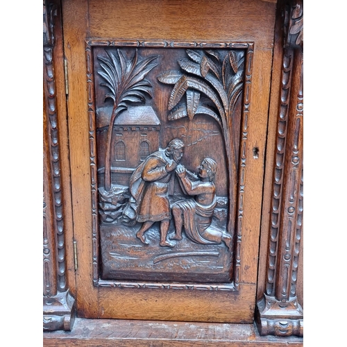 1046 - A large late 19th century Flemish carved oak sideboard, 164cm wide.