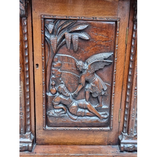 1046 - A large late 19th century Flemish carved oak sideboard, 164cm wide.