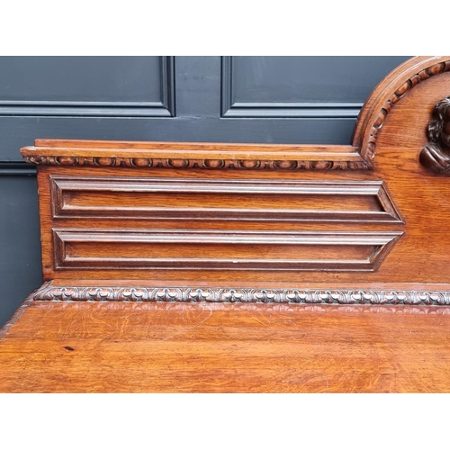 1046 - A large late 19th century Flemish carved oak sideboard, 164cm wide.