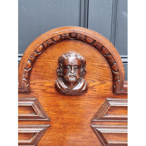 1046 - A large late 19th century Flemish carved oak sideboard, 164cm wide.