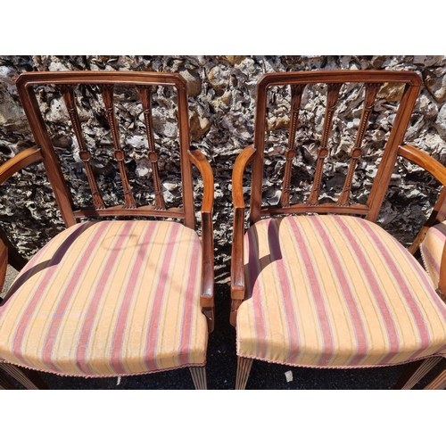 1052 - A set of eight George III mahogany dining chairs, to include a pair of elbow chairs.... 