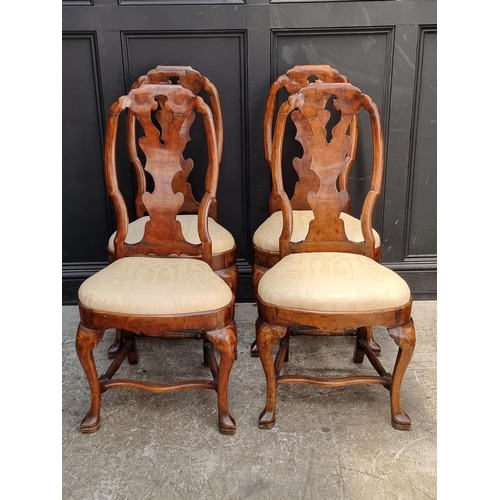 1053 - A set of four 18th century Swedish walnut dining chairs.