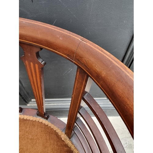 1059 - A circa 1900 mahogany and inlaid salon tub chair.