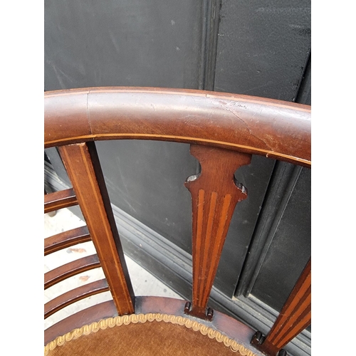 1059 - A circa 1900 mahogany and inlaid salon tub chair.