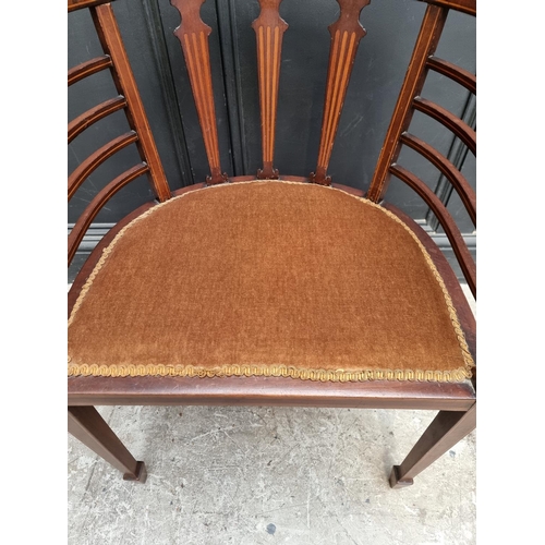 1059 - A circa 1900 mahogany and inlaid salon tub chair.