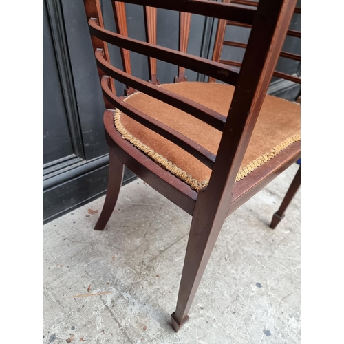 1059 - A circa 1900 mahogany and inlaid salon tub chair.