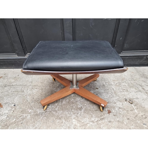 1062 - A mid-century G Plan black vinyl 'Blofeld' swivel armchair and matching stool.