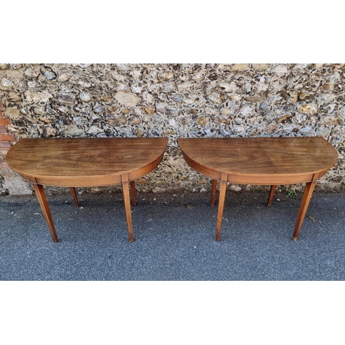 1070 - A pair of early 19th century mahogany console tables, 125.5cm wide; together with additional le... 