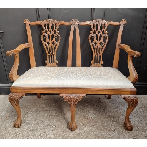 1071 - A George III style carved mahogany chairback settee, 118.5cm wide.