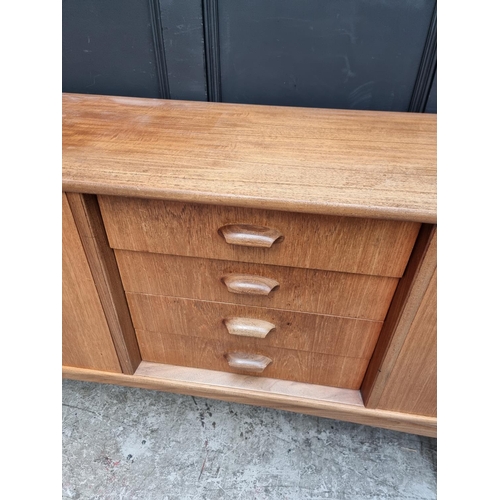 1073 - A mid-century G Plan teak sideboard, 208cm wide.