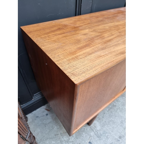 1073 - A mid-century G Plan teak sideboard, 208cm wide.