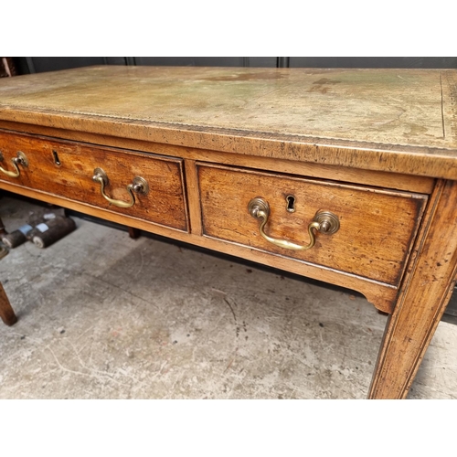 1074 - A George III mahogany desk, with green tooled leather inset surface, 119.5cm wide.... 