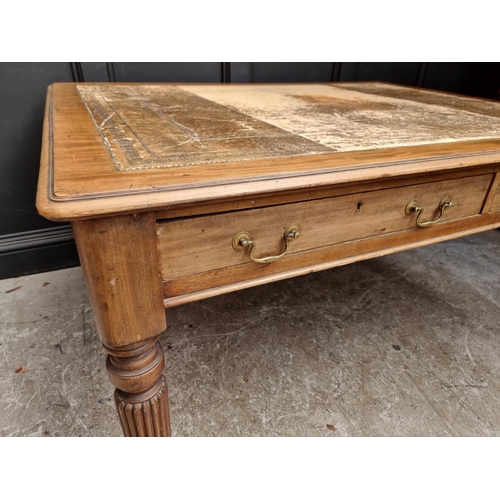 1075 - An early 19th century mahogany partners' desk, on reeded legs, 119 x 152cm.