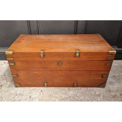 1077 - A late 19th century teak and brass bound chest, 94cm wide.