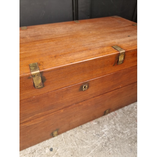 1077 - A late 19th century teak and brass bound chest, 94cm wide.