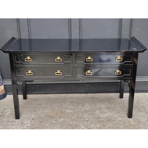 1083 - A Chinese style black lacquered altar table, 138cm wide.