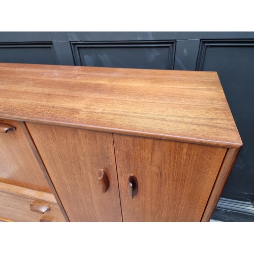 1089 - A mid-century G Plan teak side cabinet, 129.5cm wide.