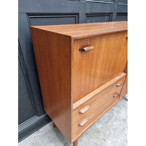 1089 - A mid-century G Plan teak side cabinet, 129.5cm wide.