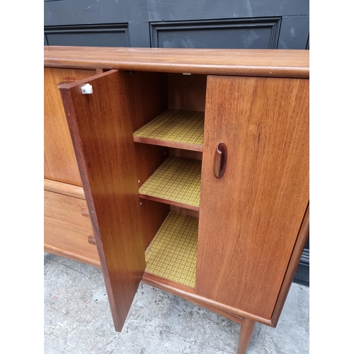 1089 - A mid-century G Plan teak side cabinet, 129.5cm wide.