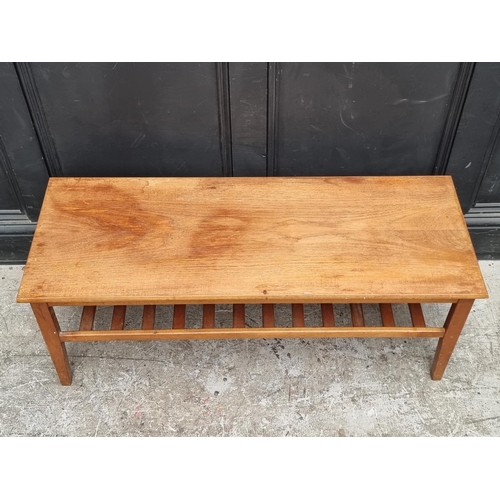 1090 - A mid-century teak rectangular low occasional table, labelled 'Herbert E Gibbs', 106.5cm wide.... 