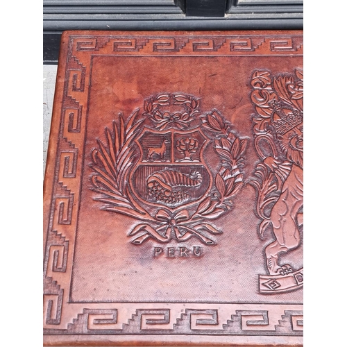 1095 - A Peruvian mahogany and embossed leather rectangular low occasional table, probably by Angel Pazmino... 