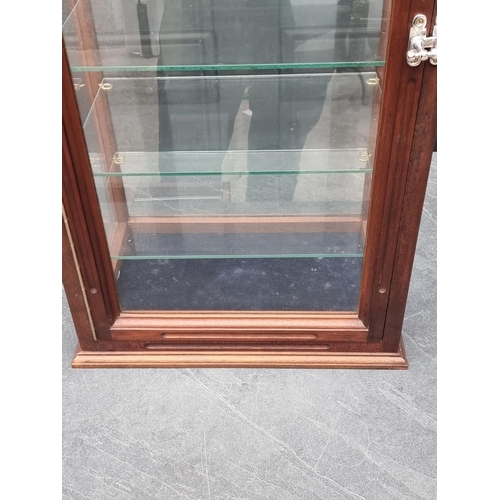 1098 - A contemporary mahogany table top display cabinet, 76cm high x 38.5cm wide x 26cm deep; togethe... 