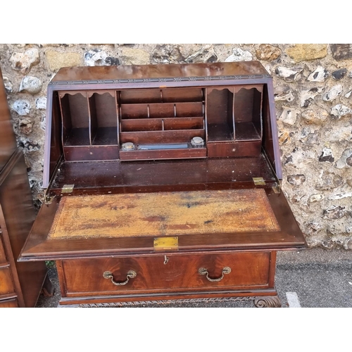 1103 - A 1920s mahogany bureau, 76cm wide; together with a small reproduction walnut chest on chest, 54cm w... 