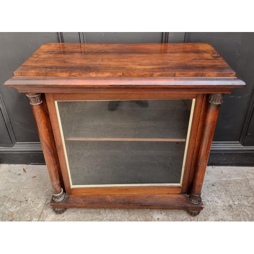 1105 - An early Victorian rosewood pier cabinet, 98cm wide, (lacking superstructure).