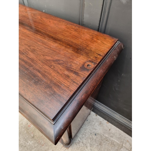 1105 - An early Victorian rosewood pier cabinet, 98cm wide, (lacking superstructure).