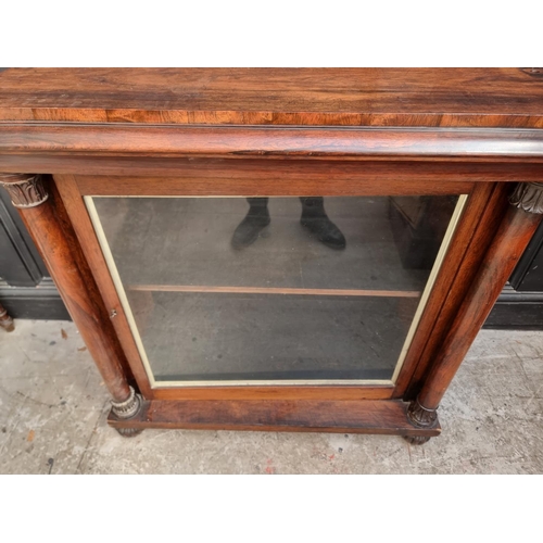 1105 - An early Victorian rosewood pier cabinet, 98cm wide, (lacking superstructure).