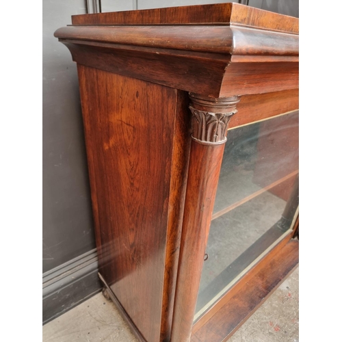 1105 - An early Victorian rosewood pier cabinet, 98cm wide, (lacking superstructure).