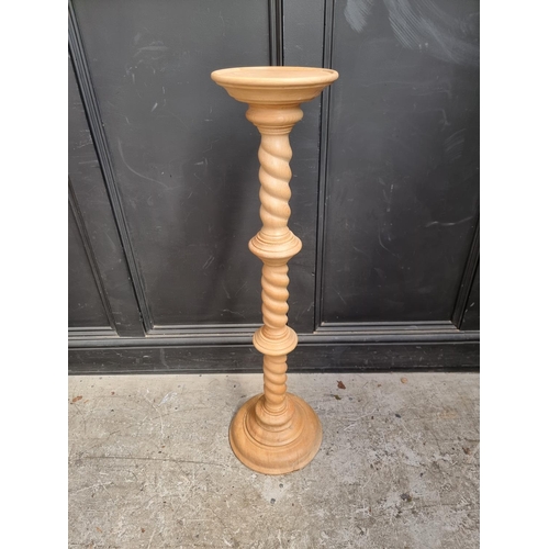 1112 - A pine barley twist column torchere, 100.5cm high.