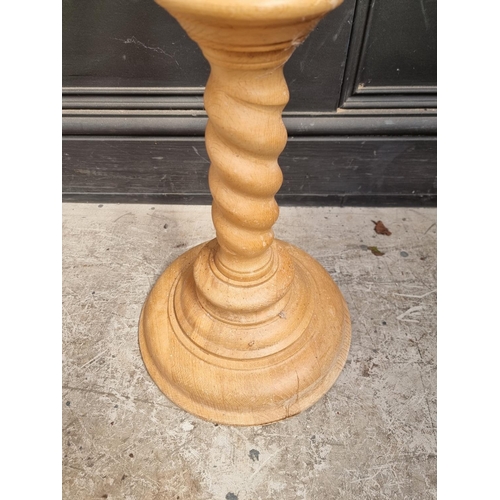 1112 - A pine barley twist column torchere, 100.5cm high.