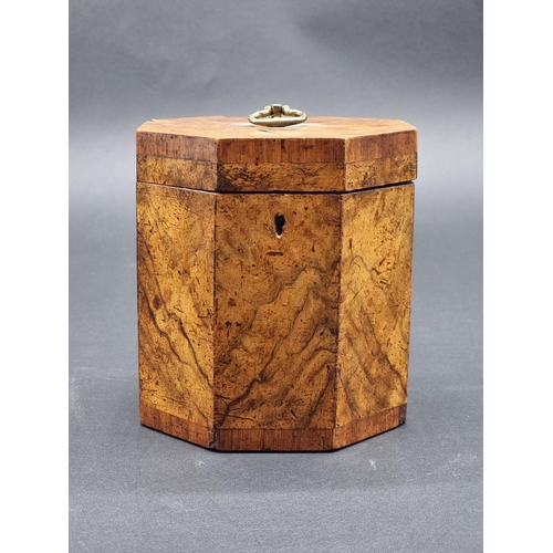 1125 - A George III figured walnut and parquetry octagonal tea caddy, 14.5cm high, with key.... 