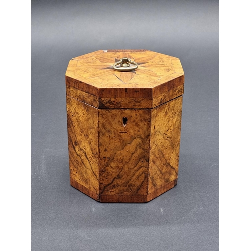 1125 - A George III figured walnut and parquetry octagonal tea caddy, 14.5cm high, with key.... 