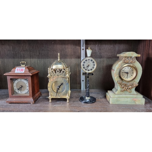 1130 - Four vintage timepieces, to include a brass lantern clock style example, 17.5cm high. (4)... 