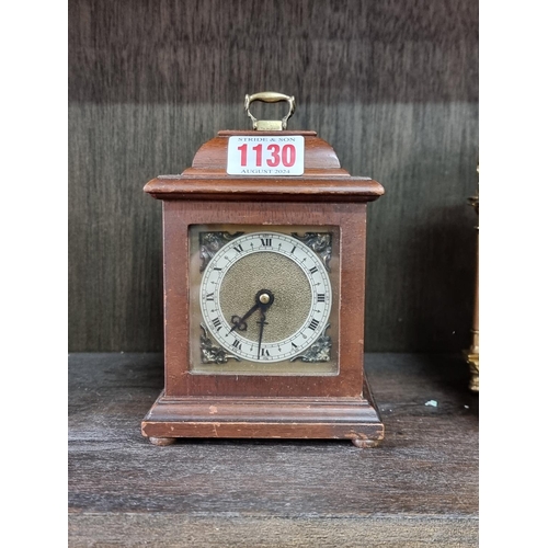 1130 - Four vintage timepieces, to include a brass lantern clock style example, 17.5cm high. (4)... 