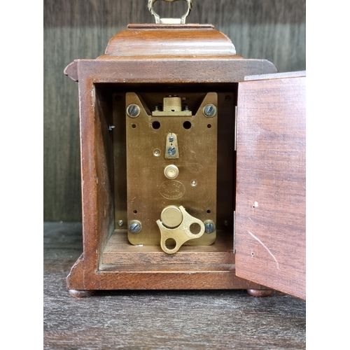 1130 - Four vintage timepieces, to include a brass lantern clock style example, 17.5cm high. (4)... 