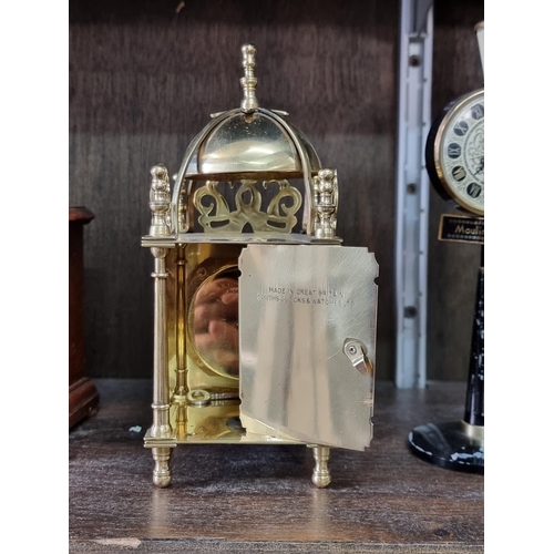 1130 - Four vintage timepieces, to include a brass lantern clock style example, 17.5cm high. (4)... 