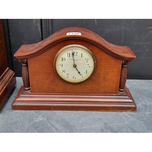 1135 - An Edwardian mahogany and inlaid lancet form mantel clock, 32cm high, with pendulum; together with a... 