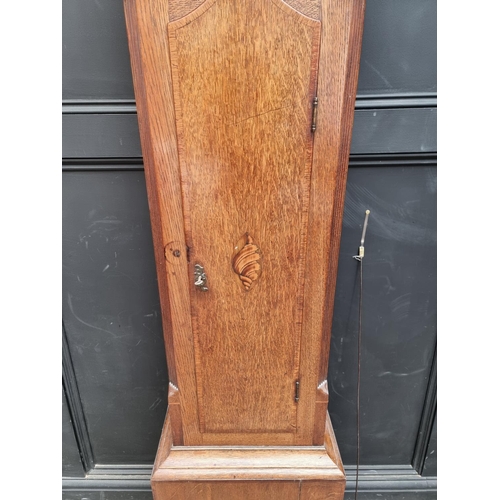 1140 - A George III oak and mahogany eight day longcase clock, the 12in painted arched dial inscribed ... 